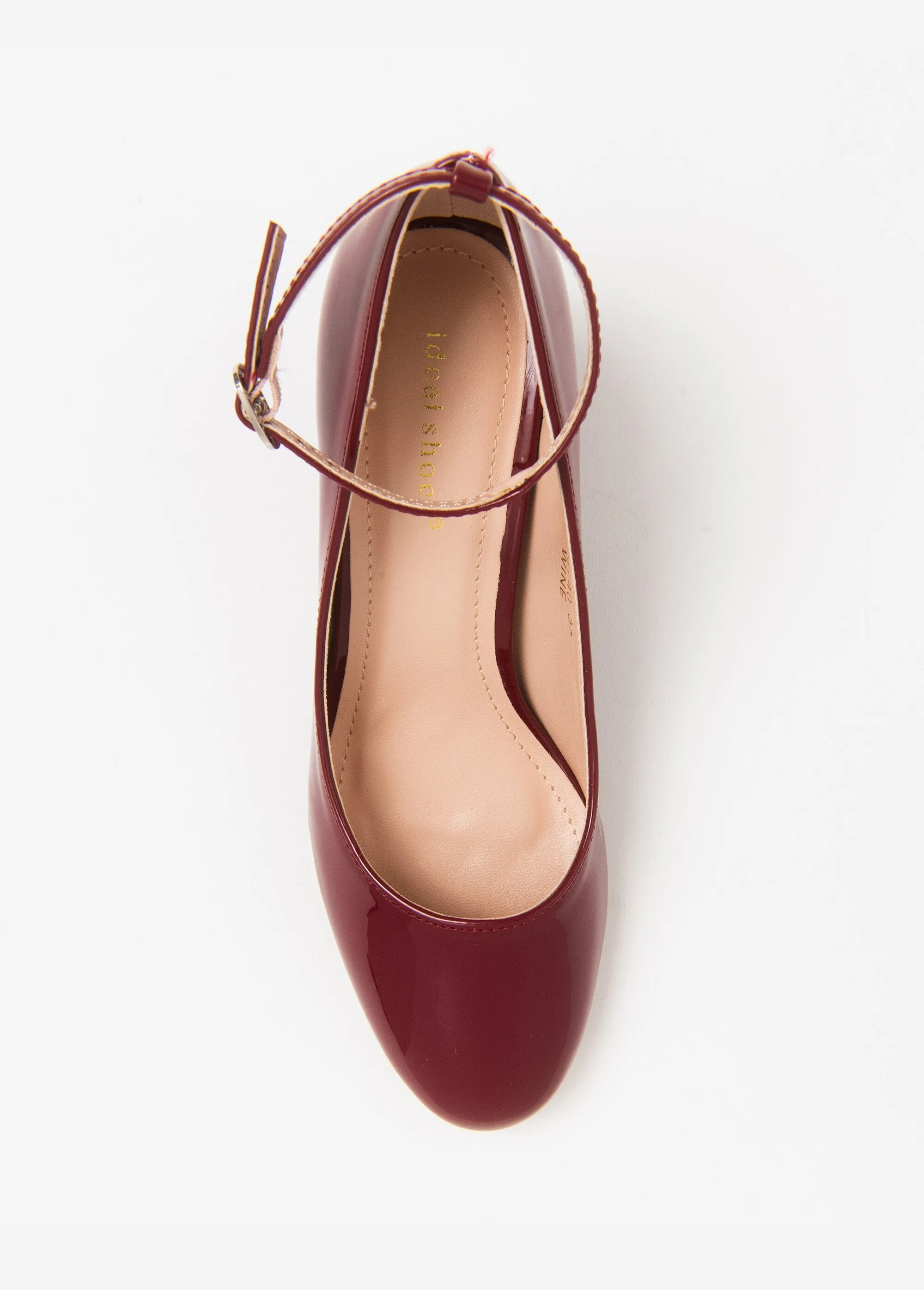 Patent pumps with ankle strap heel