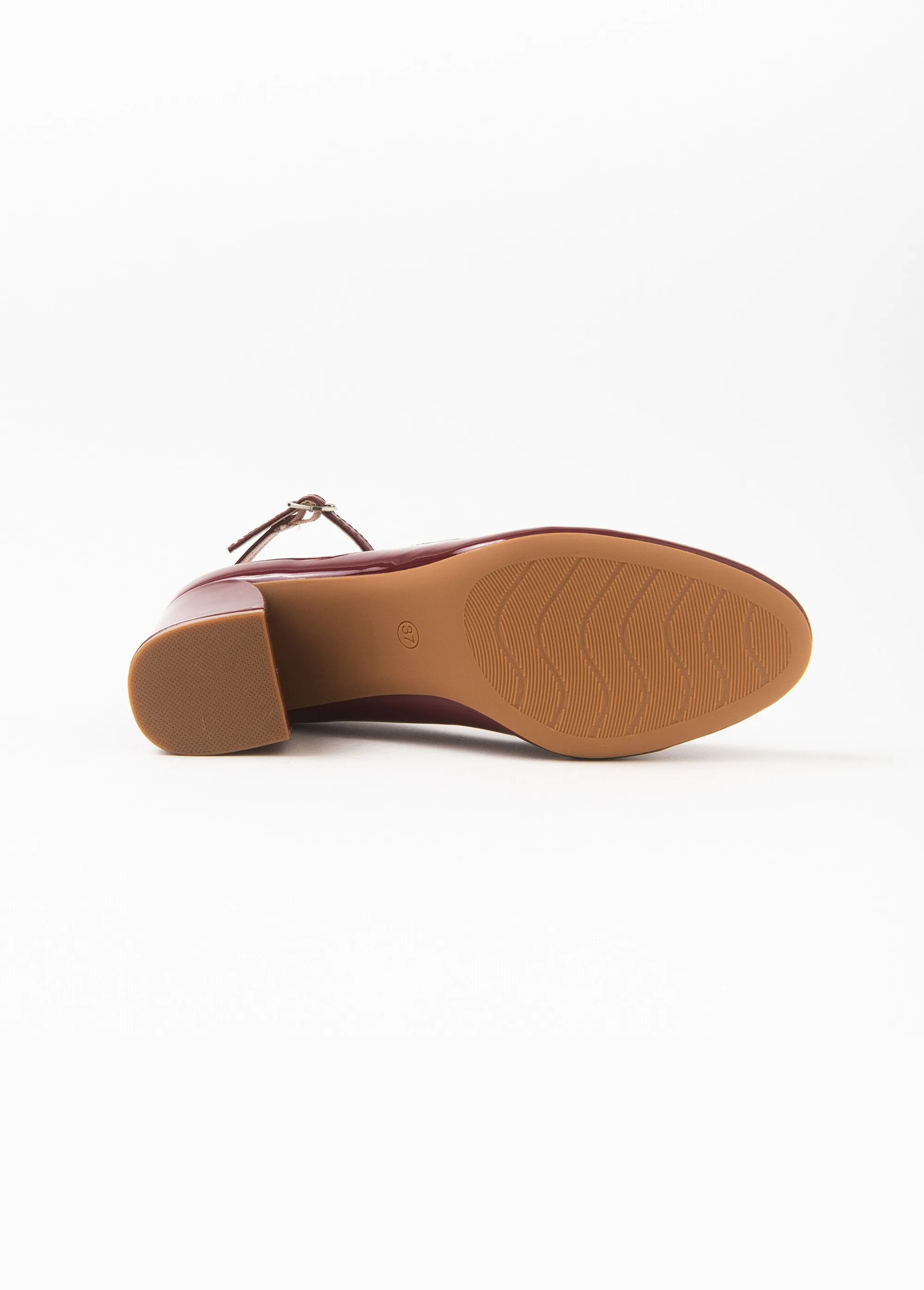 Patent pumps with ankle strap heel