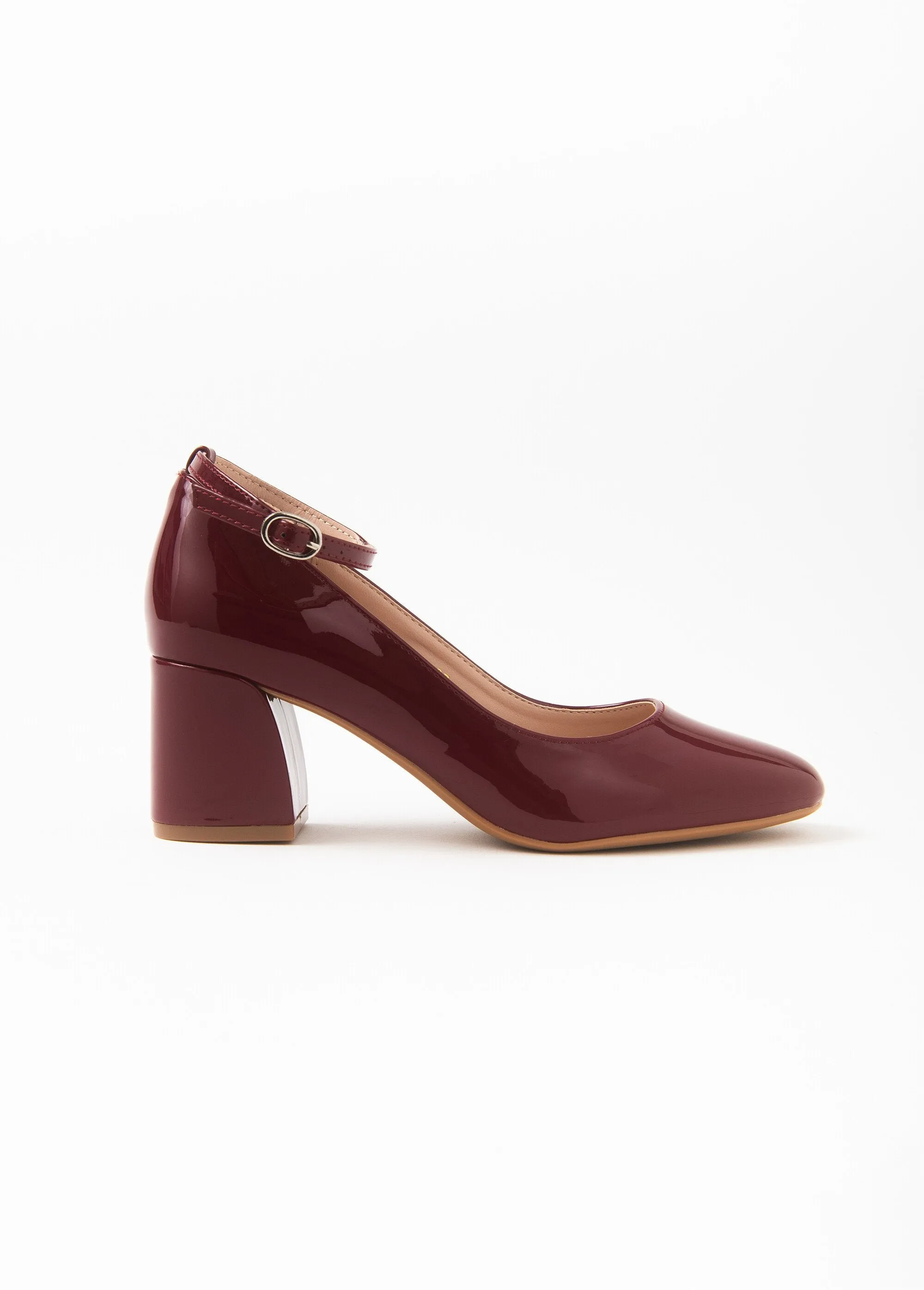 Patent pumps with ankle strap heel